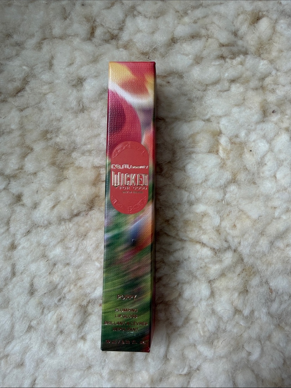 r.e.m. beauty x Wicked For Good Plumping Lip Gloss in the shade Poppy